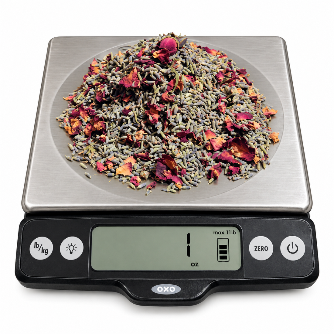 Freshly dried herbs weighed on a kitchen scale